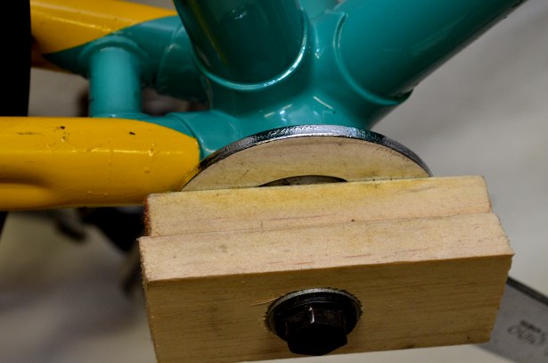 Bolt, snugly tightened into the spindle, secures wood against wrench